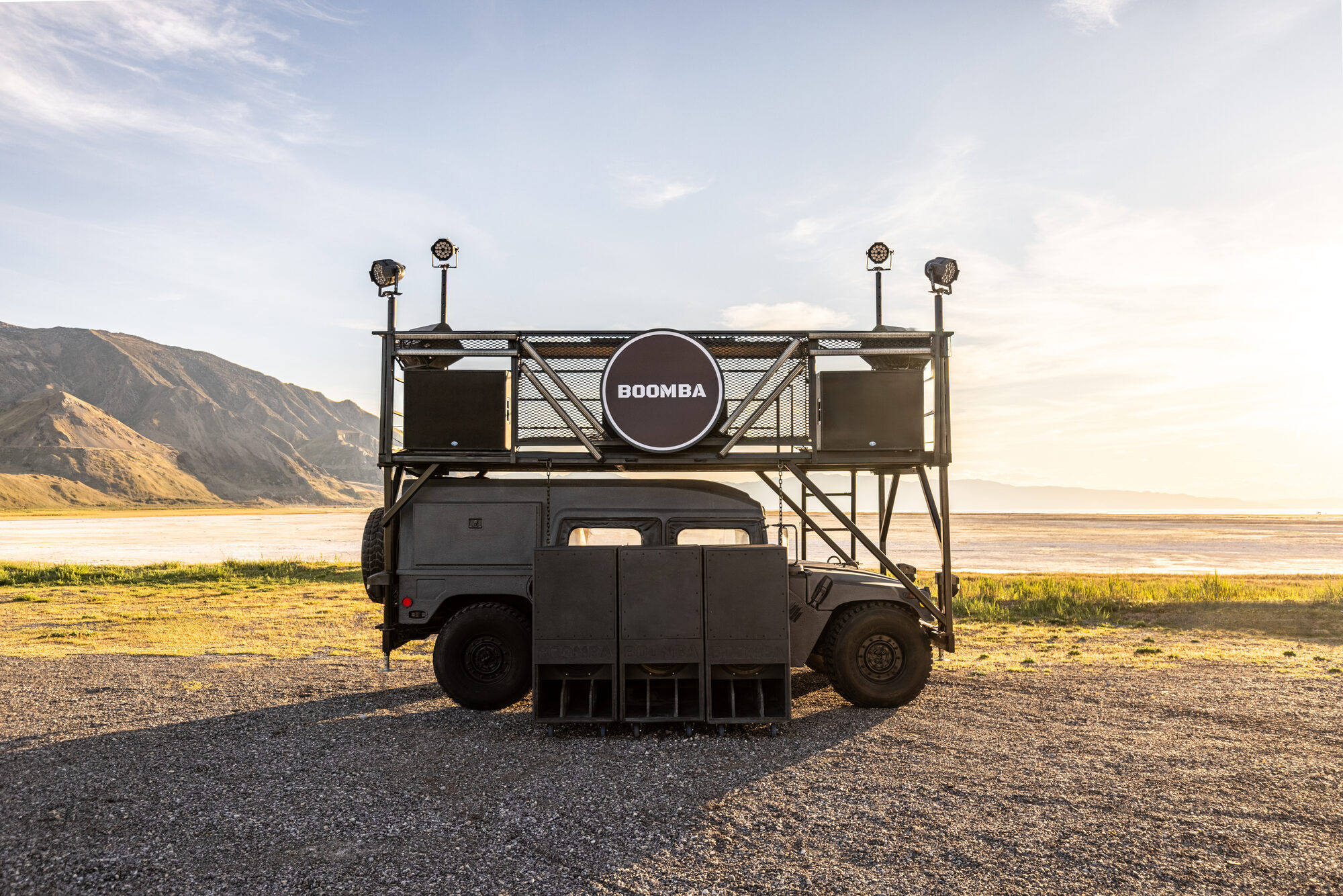 BOOMBA soundcar at golden hour with the swappable 40-inch illuminated sign